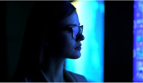 Professional viewing digital displays, symbolising Yorktel and Kinly’s unified approach to engaging audiences through managed digital signage and content services.